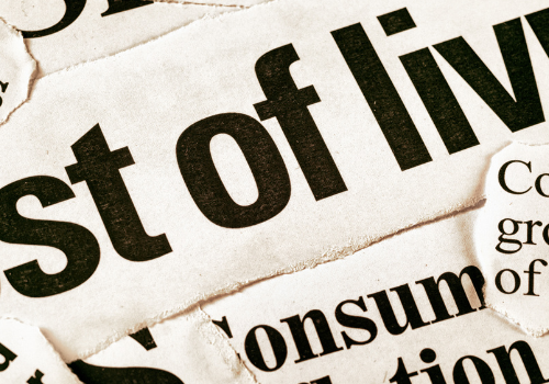 Newspaper headline reads: cost of living